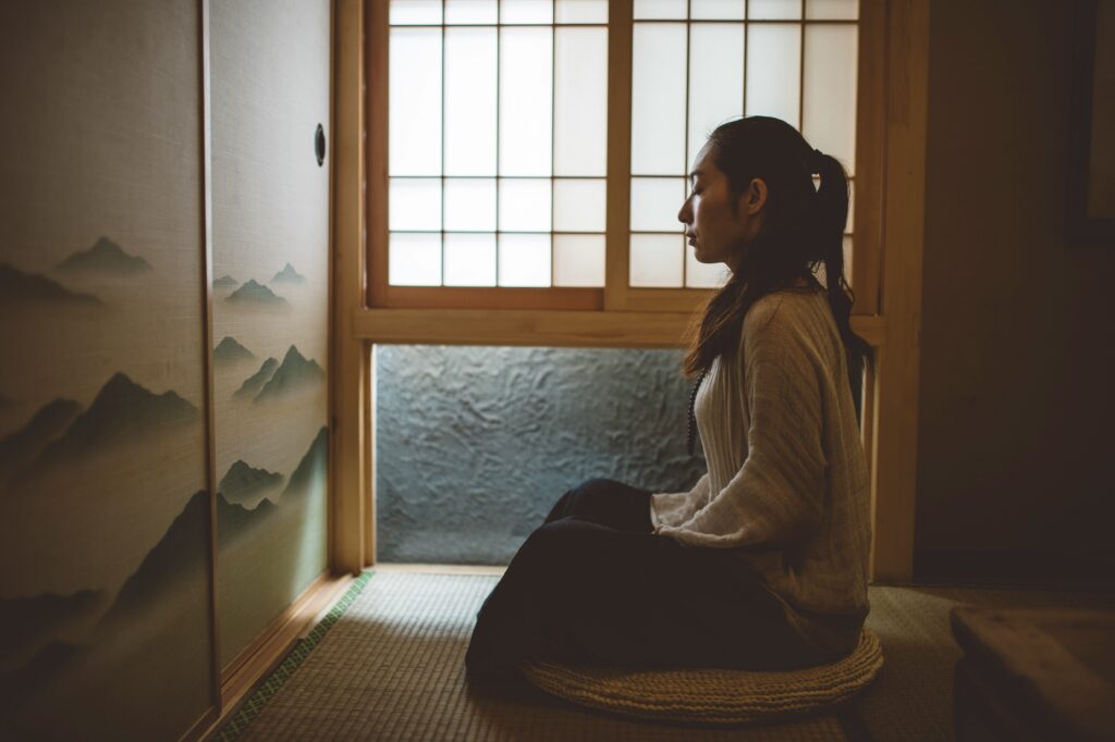Woman Meditating In Japan