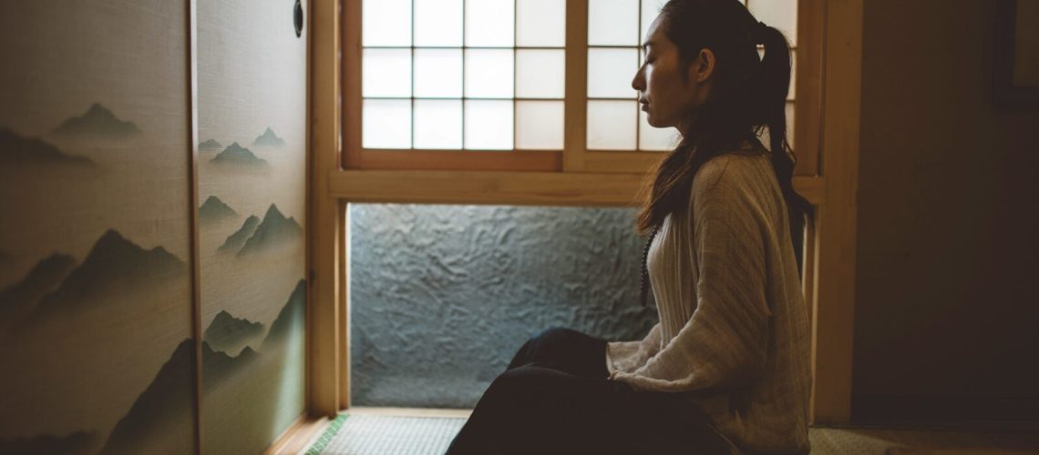 Woman Meditating In Japan